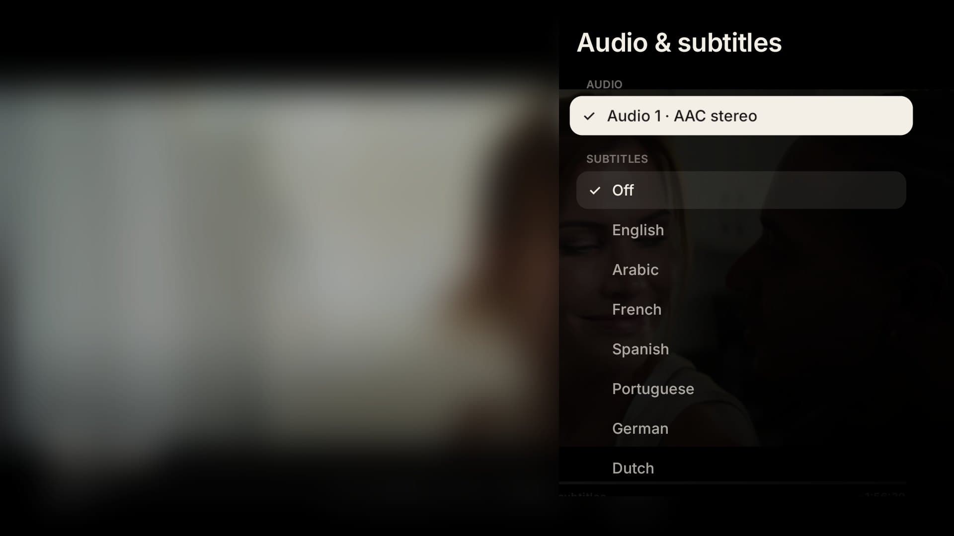 Audio and subtitles panel over a blurred video frame